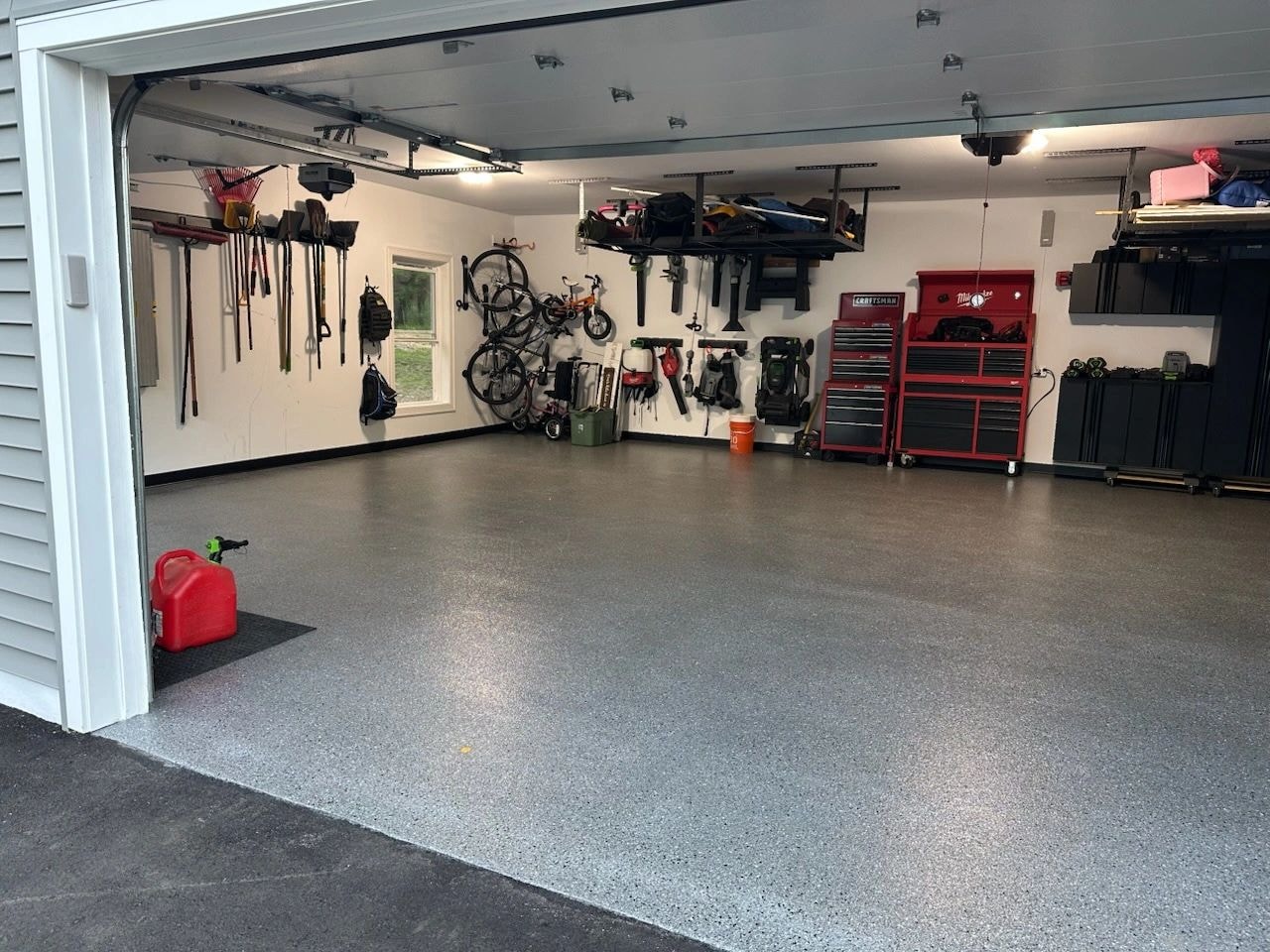 Organized residential garage with epoxy floor